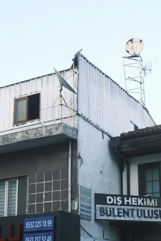 a building with a building ladder on it's roof