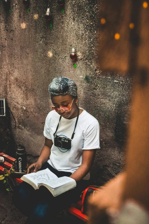 a man sits down reading a book