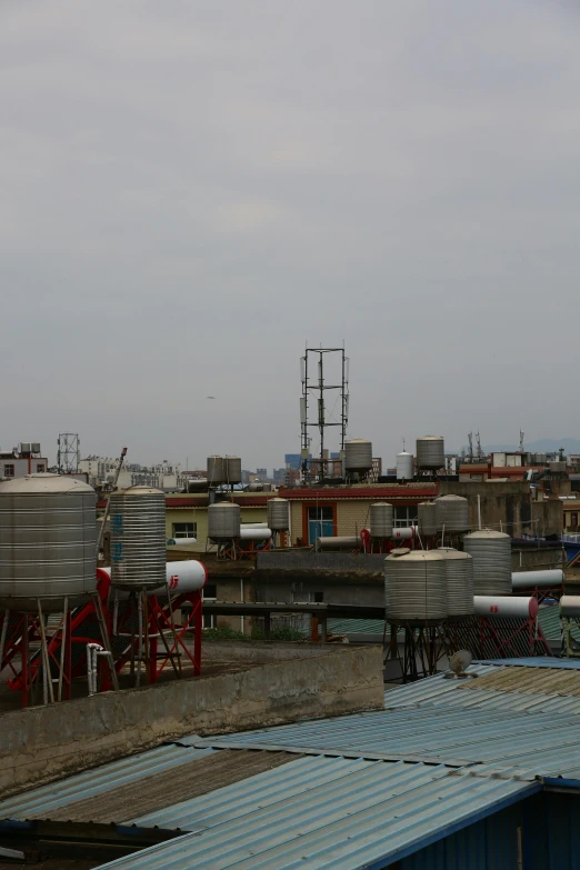 an industrial area with tanks and metal tanks on top