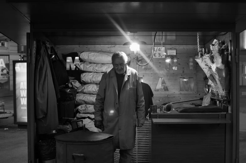 a man looking at items inside of a shed