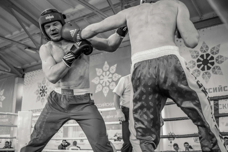 a black and white po of two fighters in the ring