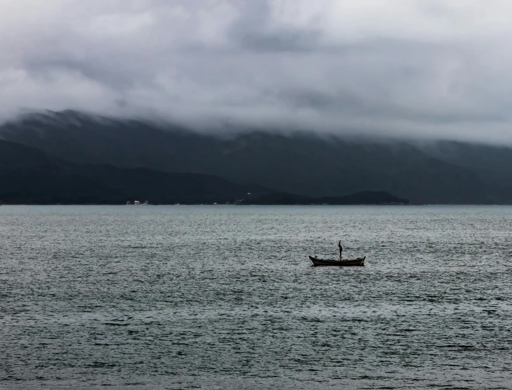 a boat floating on top of a body of water