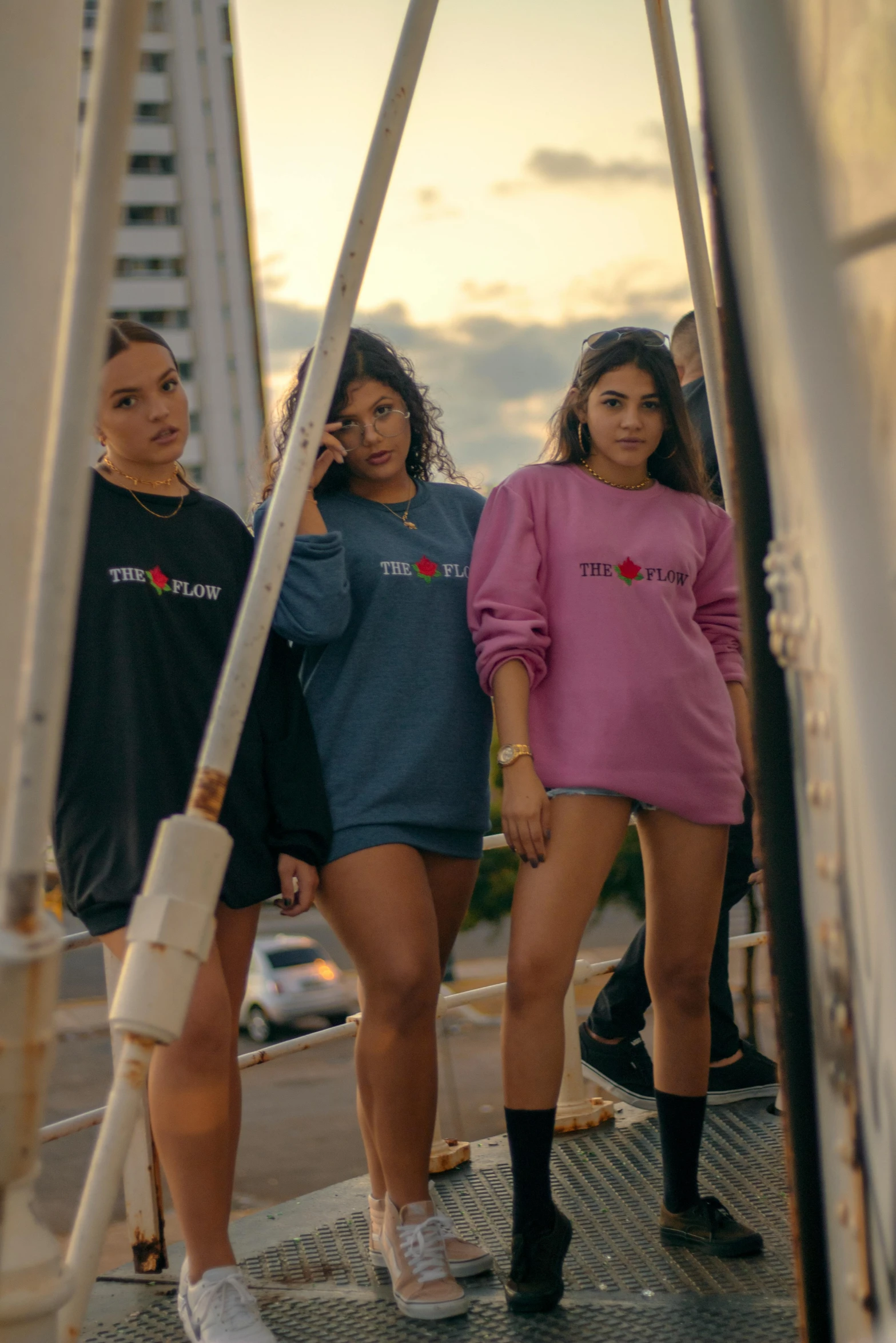 four women are walking down a stairway together