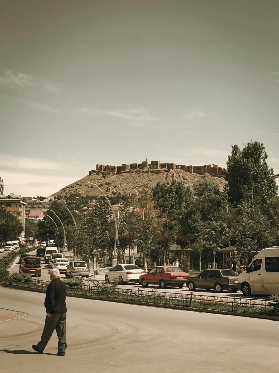 a man is walking in front of the town