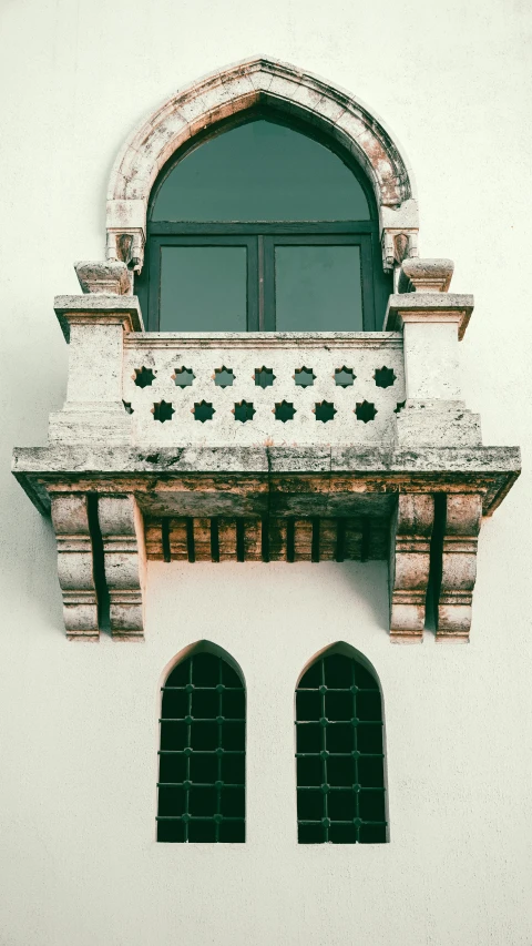 an old stone window with a window pane and round windows