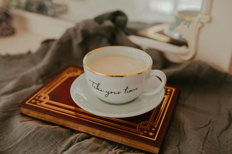 an ornate cup and saucer on a tray