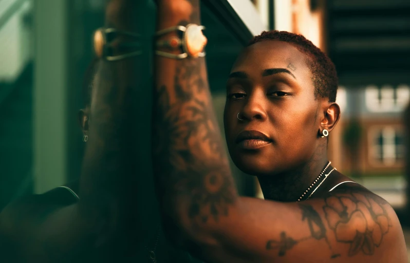 an image of a woman with piercings standing by a building