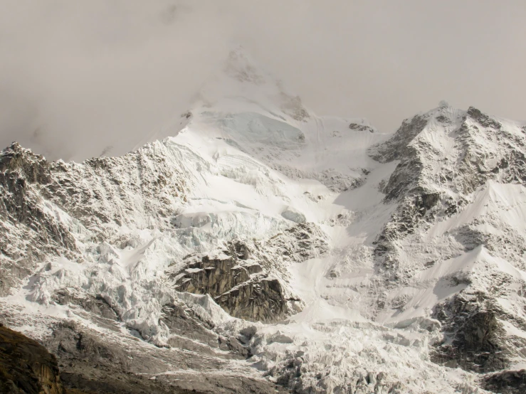 a view of the top of a mountain with snow