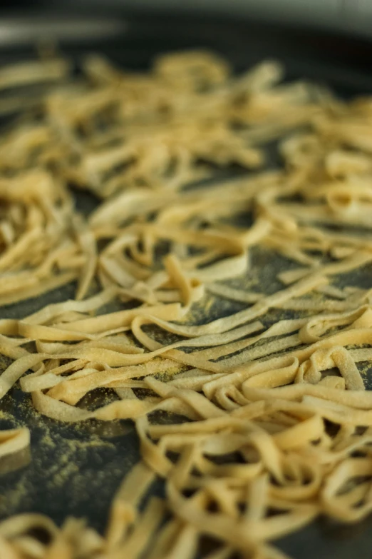a pan with cooked pasta is on top of the stove