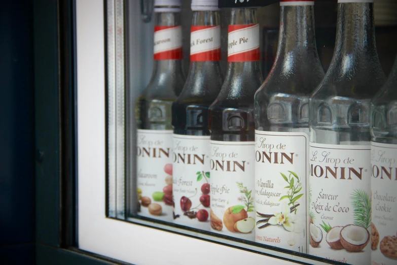 six bottles are seen behind a glass