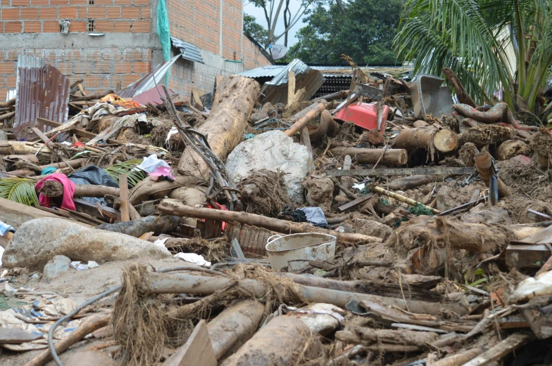 a pile of debris next to a house