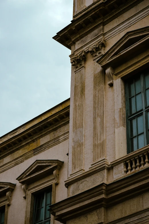 the clock is clearly visible from behind some windows