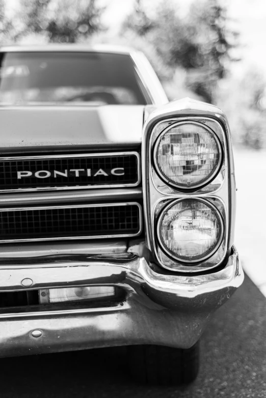 the front bumper and headlights on an old pontiac