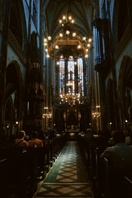 inside view of cathedral with chandeliers and pews