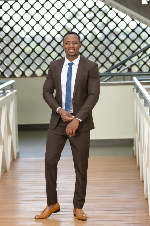 an african american man in a suit and tie is posing for a po