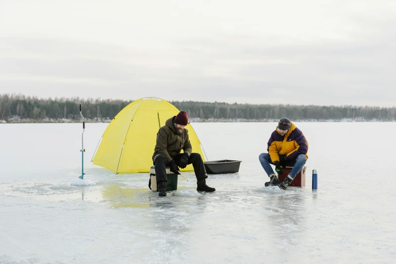 there is a man standing near the net while another holds on to the net