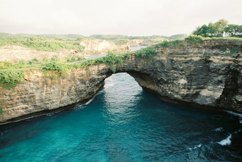 a large body of water with two cliffs