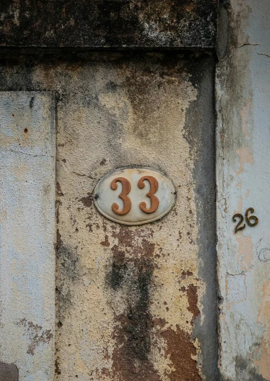 a number 28 on a rusted out metal object