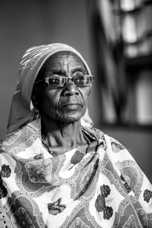 an older woman wearing glasses and a shawl