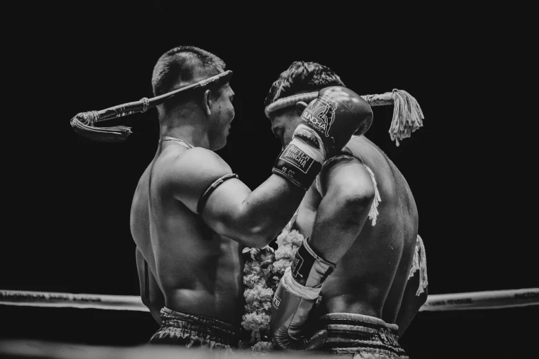 two fighters are holding their arms on each other