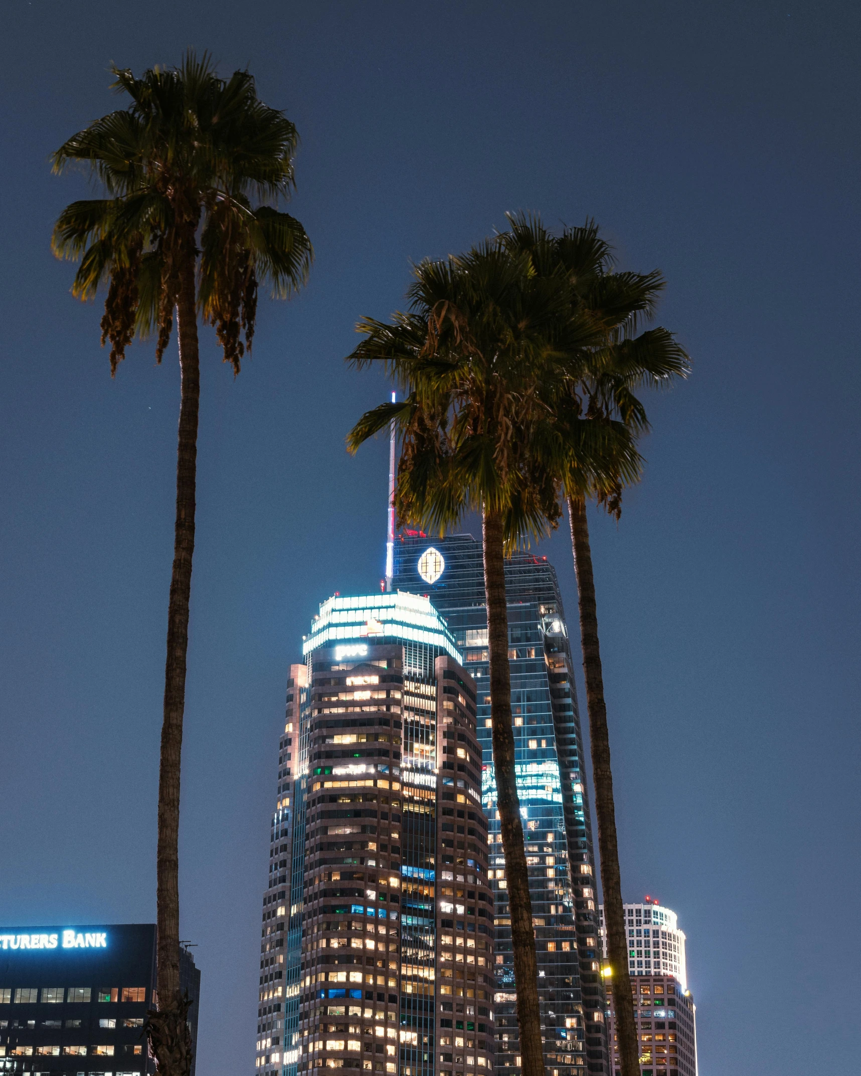 the tall building is lit up at night