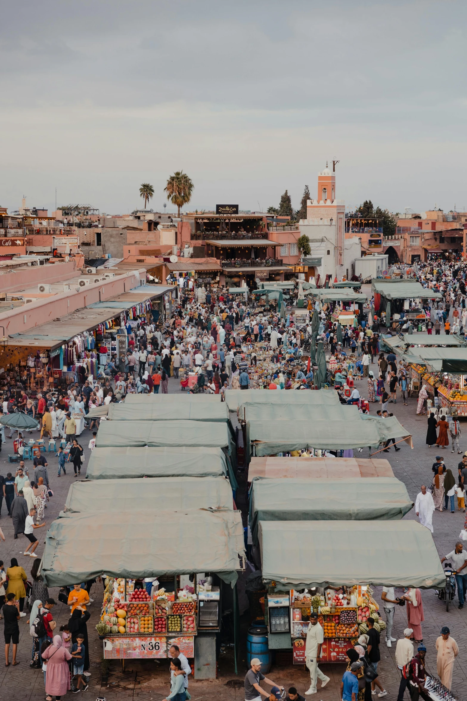 there are many people walking in the market place