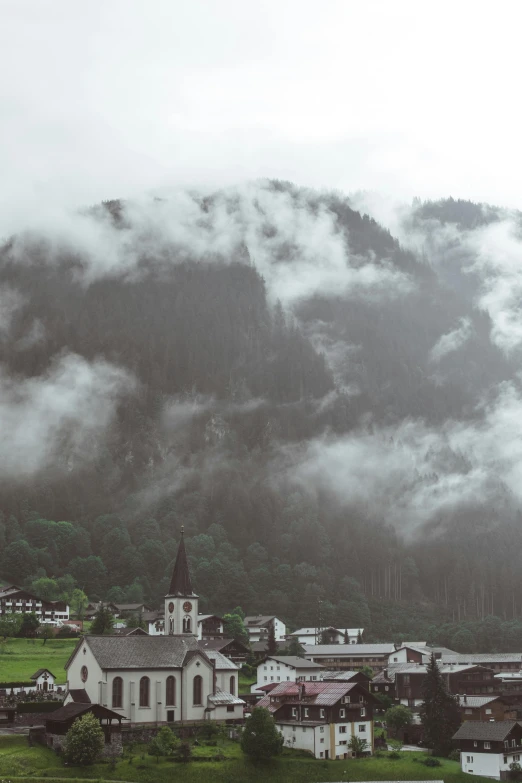 an image of a very pretty town surrounded by mountains