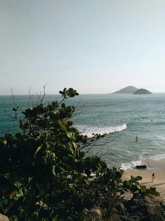 a view of an ocean with waves crashing on the shore