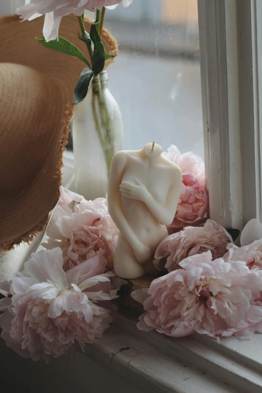 an image of flowers sitting on the windowsill