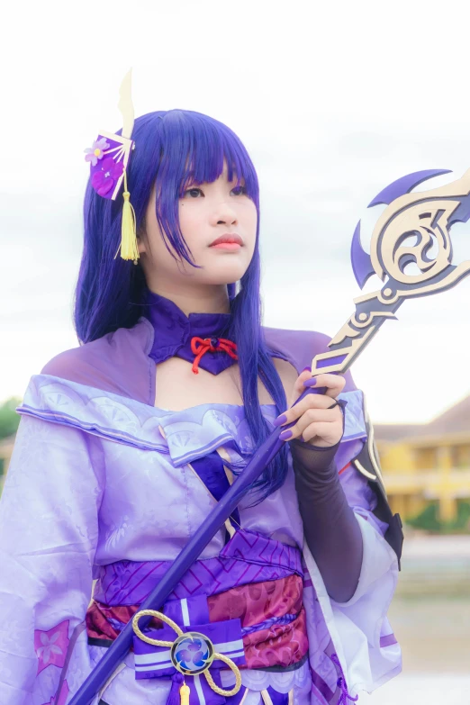 an asian girl in a purple outfit holding a sword