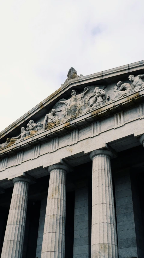 the top of an old building with columns