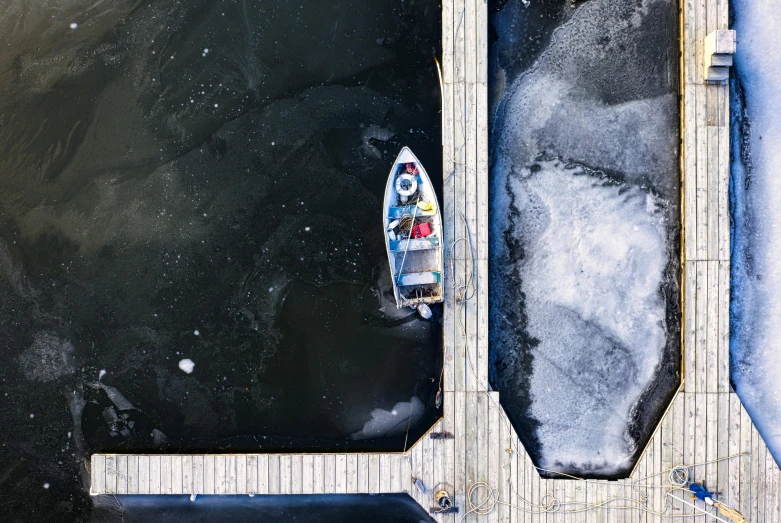 a man riding on the back of a boat in the ocean