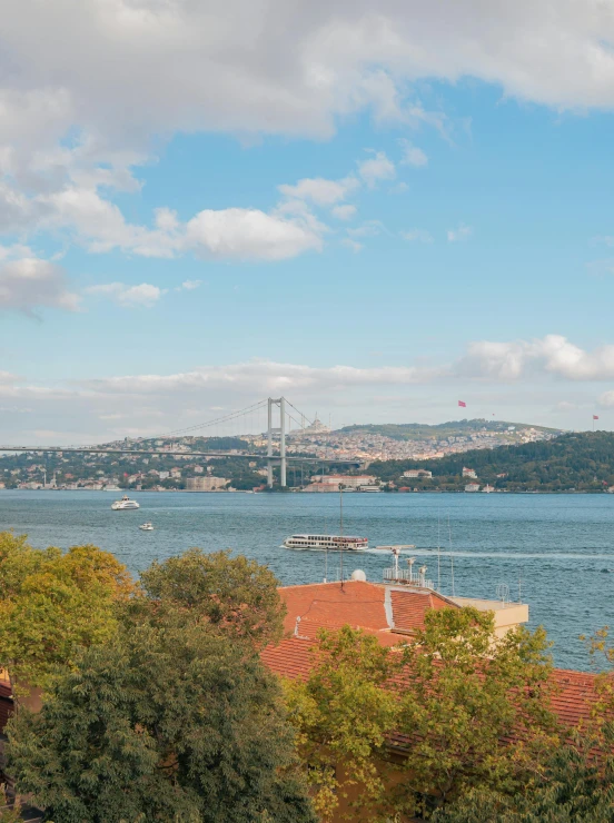 a view of water and boats on it from a hill