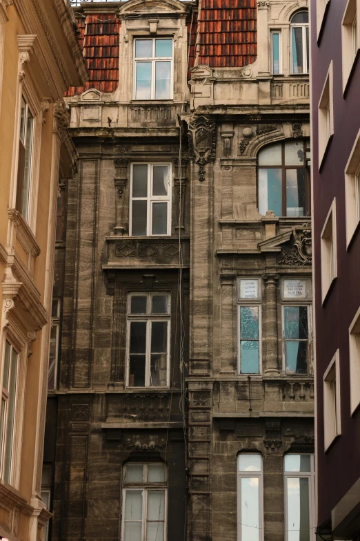 an old brick building with multiple windows and no doors