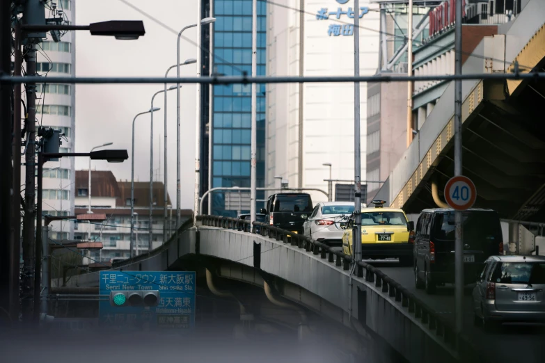 the view of traffic on a bridge in the city