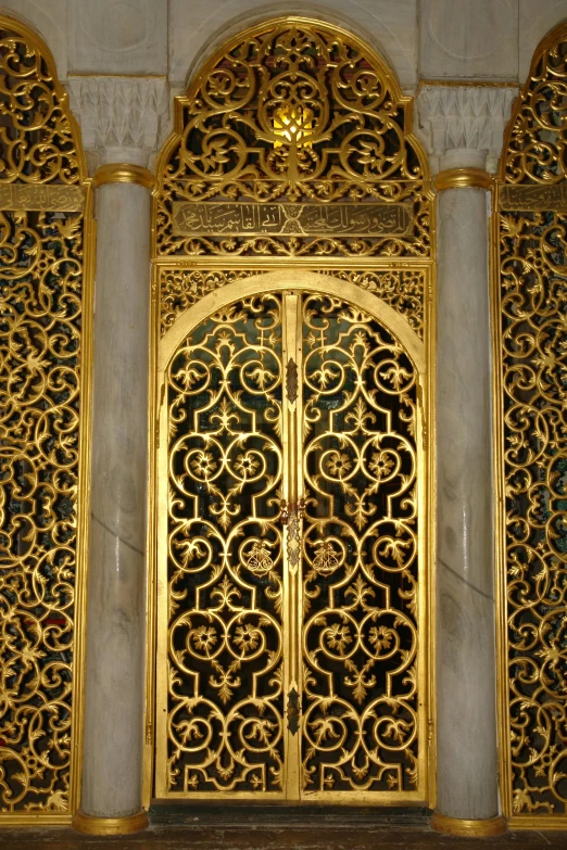 gold colored doors are shown in a doorway