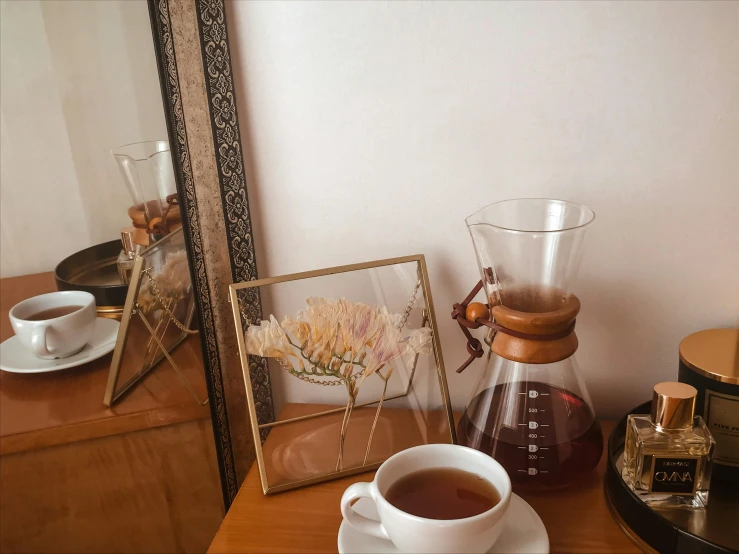 a room with a table and coffee maker on it