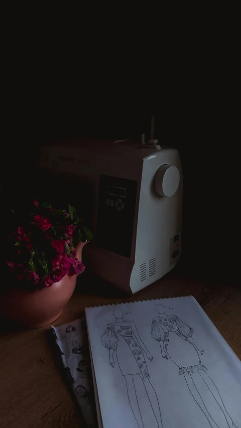 a close up of a machine and some flowers