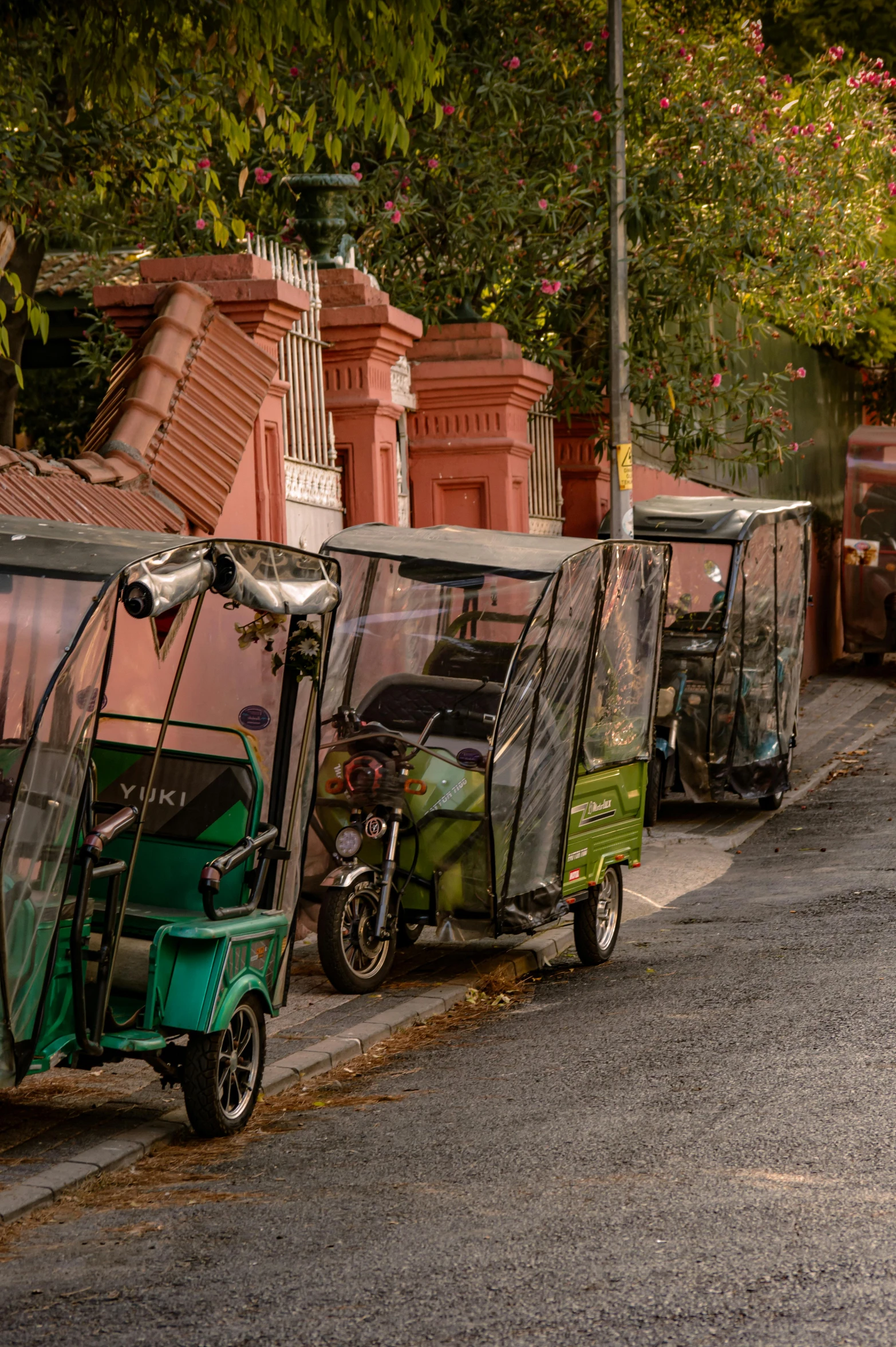 a motorized trike riding down the street next to another motorcycle