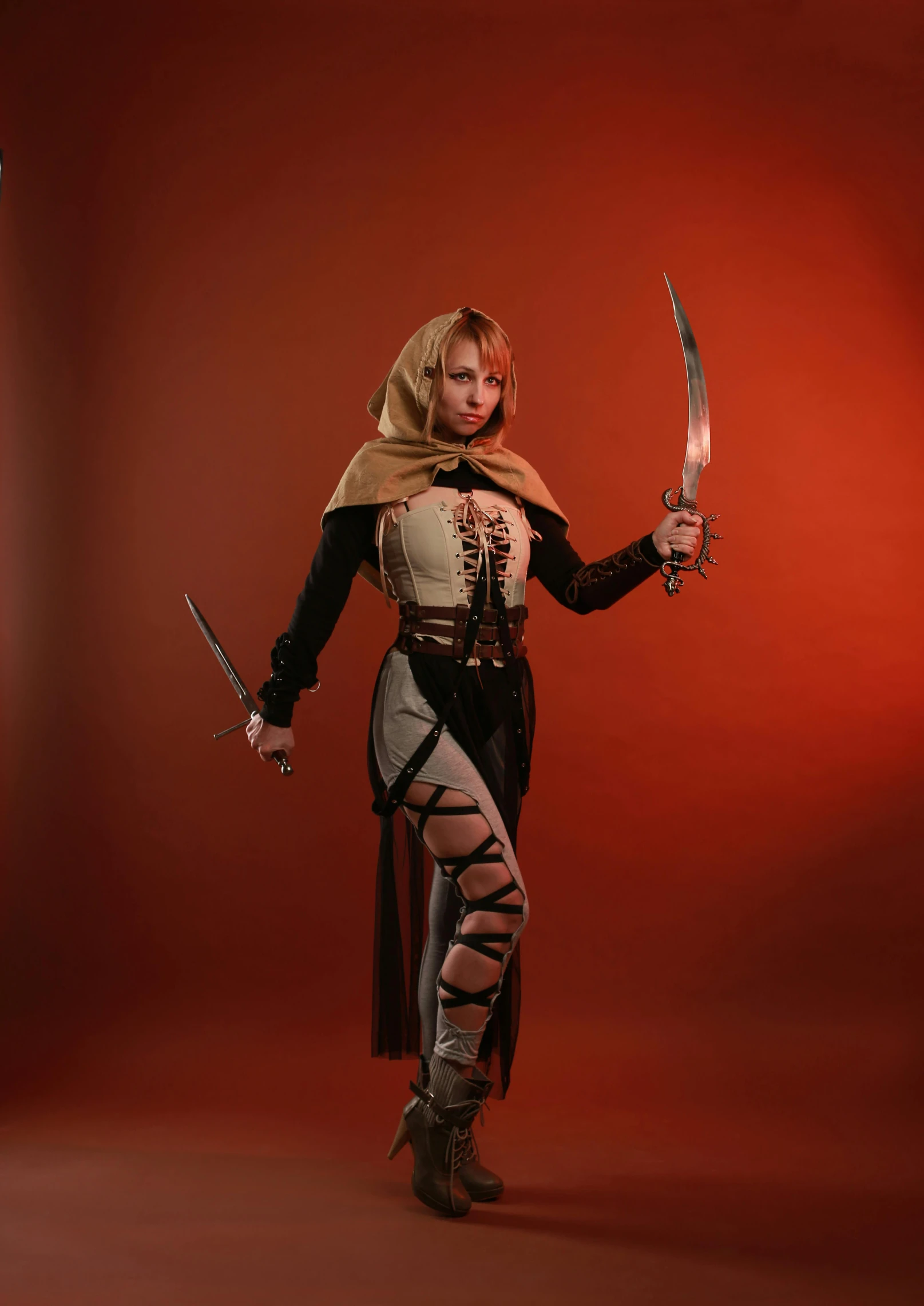 a woman in a costume holding two swords