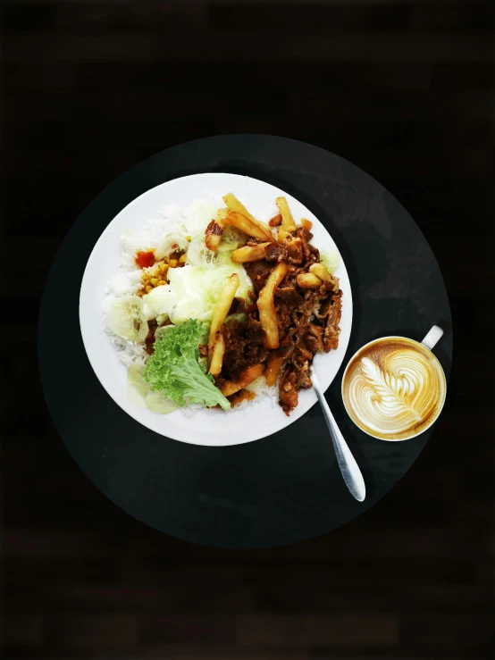 a white plate topped with meat next to a cup of coffee