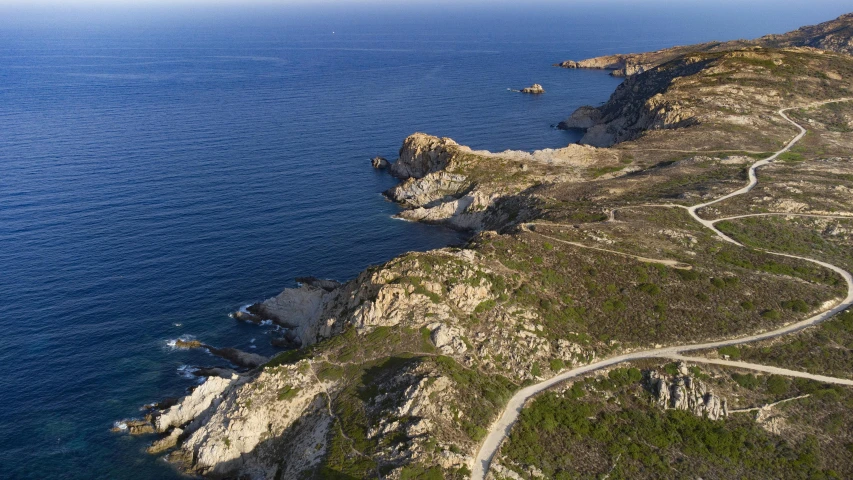 an aerial view of a coastal road in the us