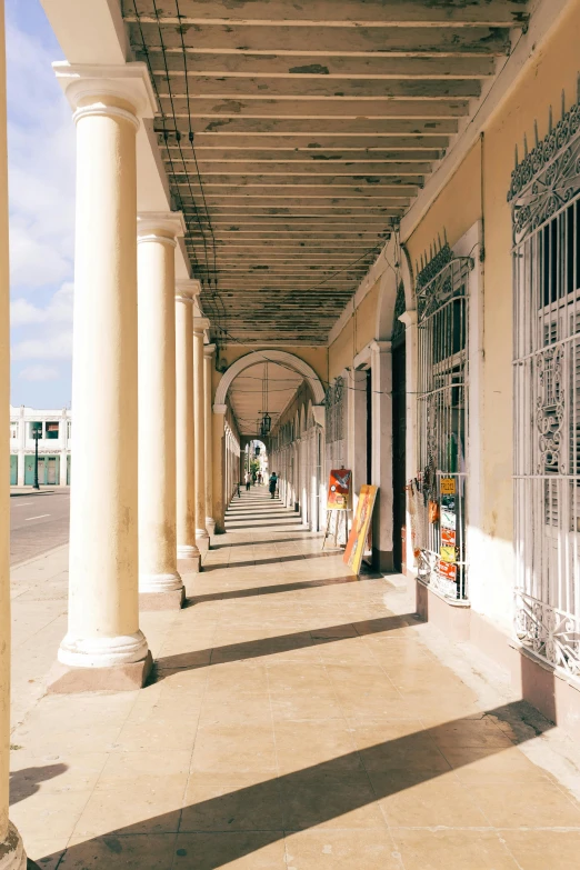 the sidewalk under the covered outdoor area is narrow