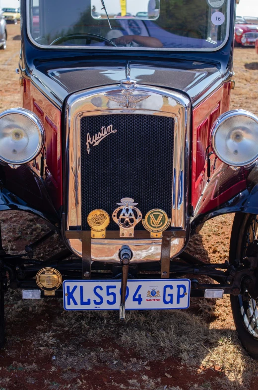 an old fashioned red truck is parked outside