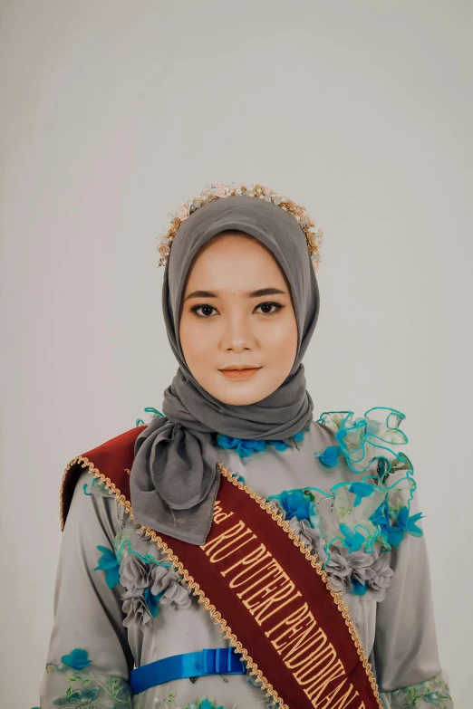 young woman wearing traditional costume and head wrap