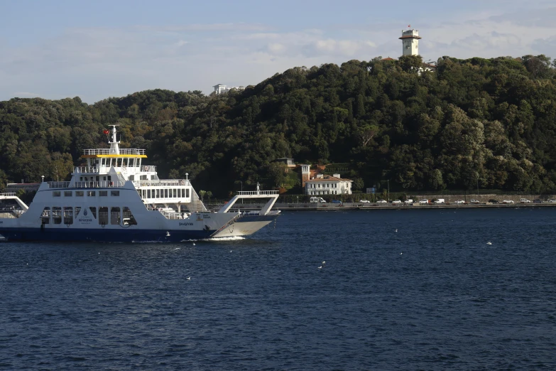 the large ferry boat is near the shore