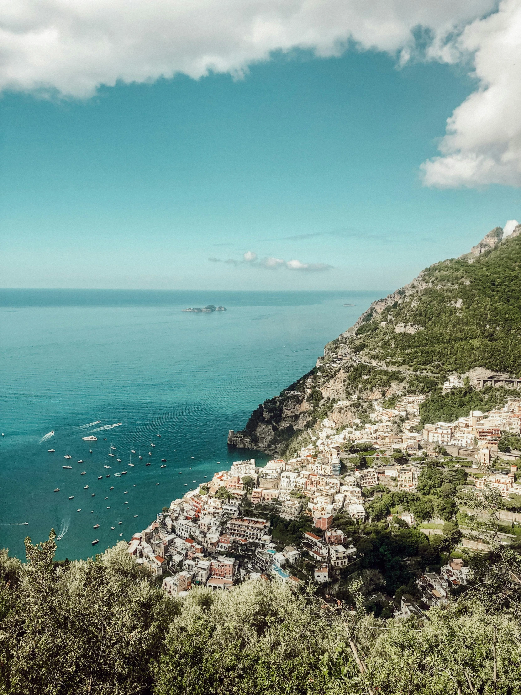 looking across an island toward a bay with some boats in the water