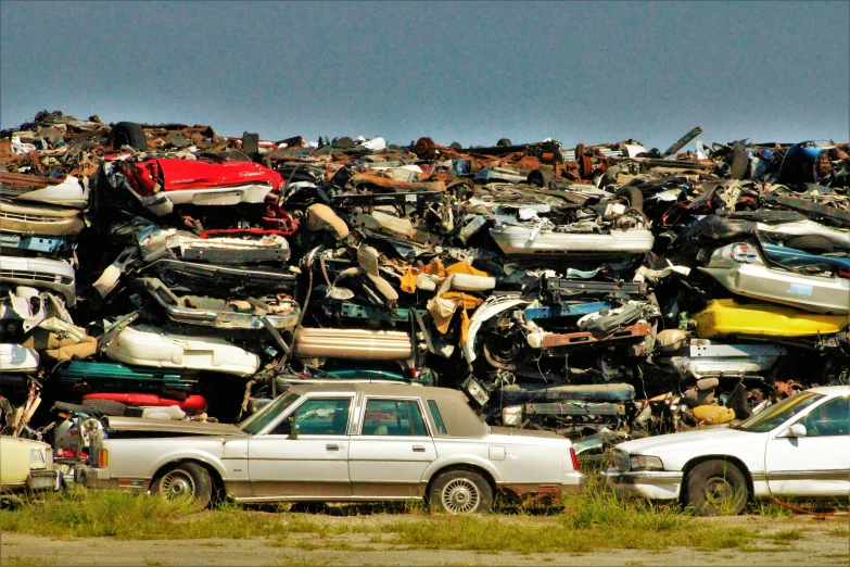 a pile of luggage sits piled high on top of a truck