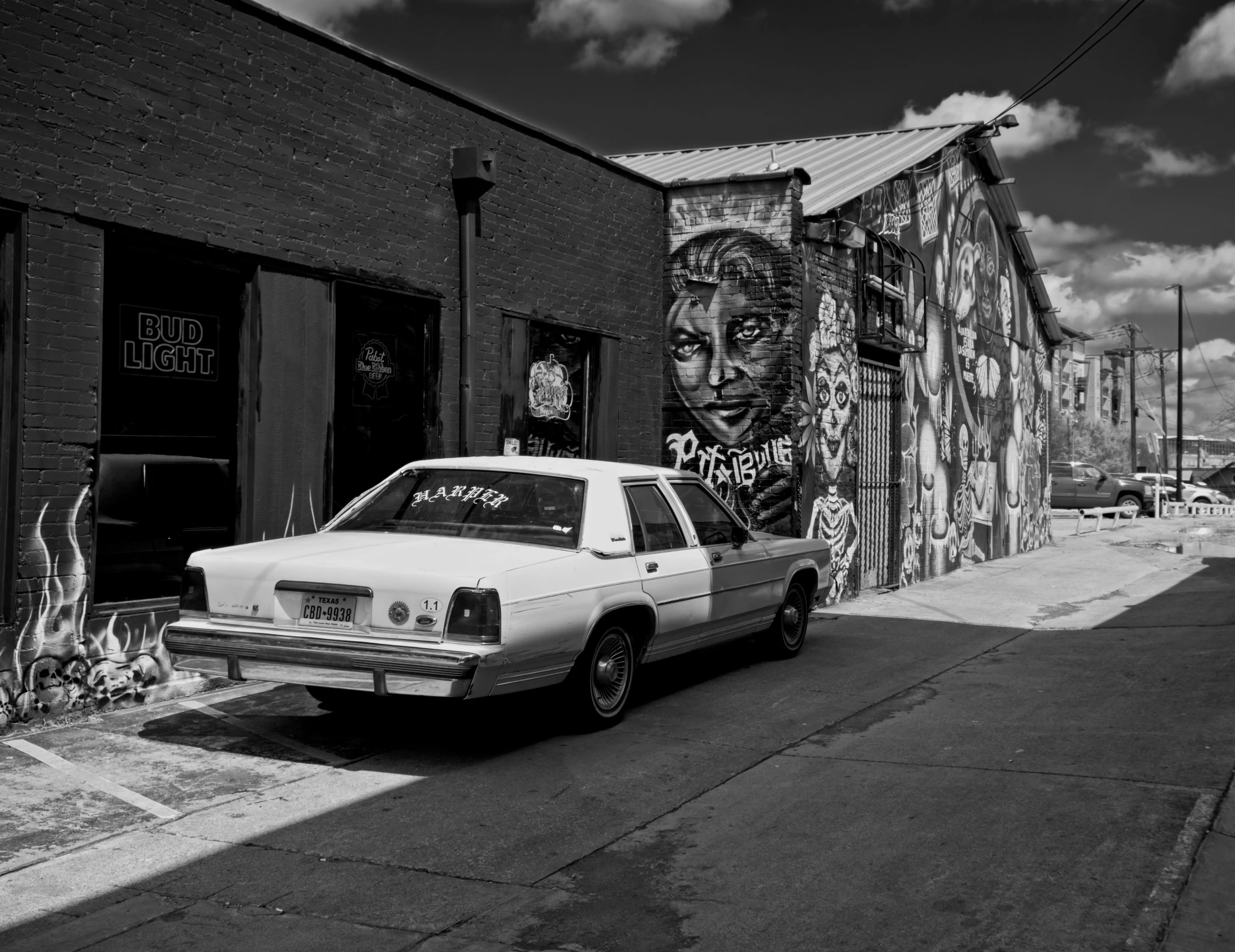 an old black and white po of a building covered in graffiti