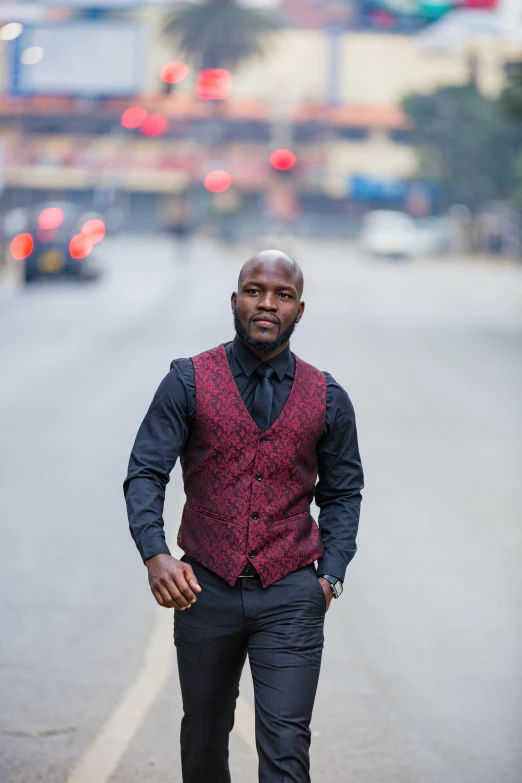 a young man is standing alone in the street